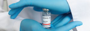 Background image depicting the COVID-19 vaccine