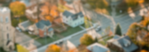 blurred background of a town street with houses