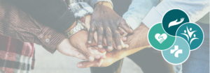 Hands piled on top of one another to signify community